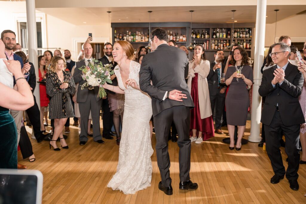 A bride and groom dancing at their wedding.