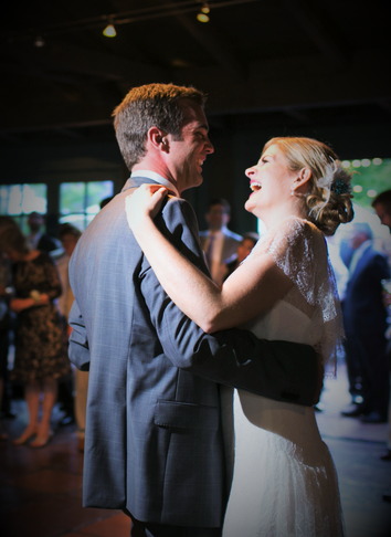 A man and woman dancing in front of a crowd.