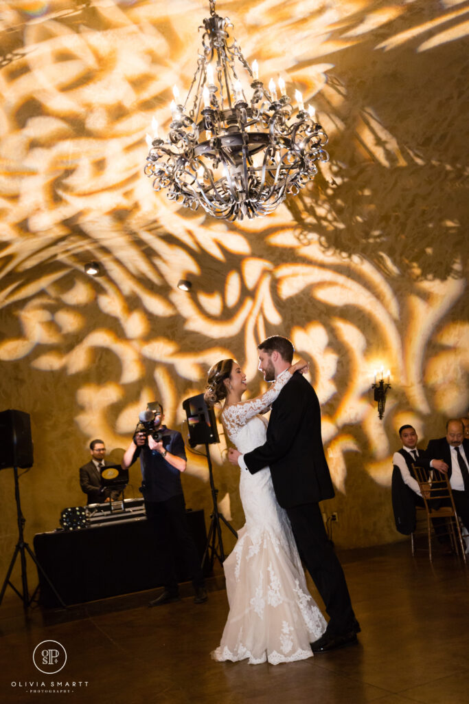 A couple is dancing in front of the band.
