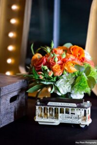 A flower arrangement in the shape of a trolley car.