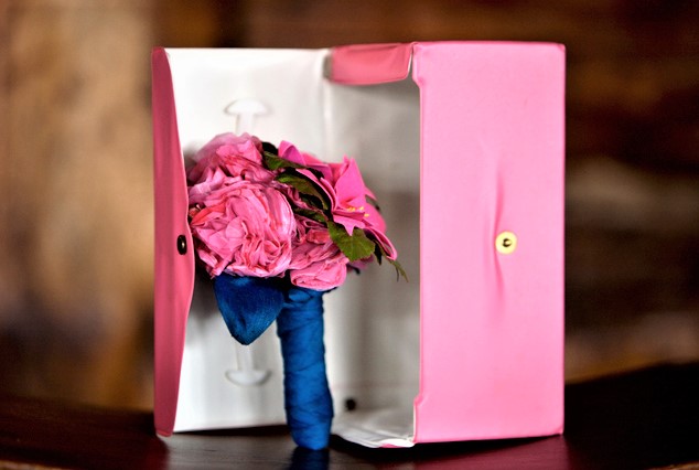 A pink box with flowers inside of it