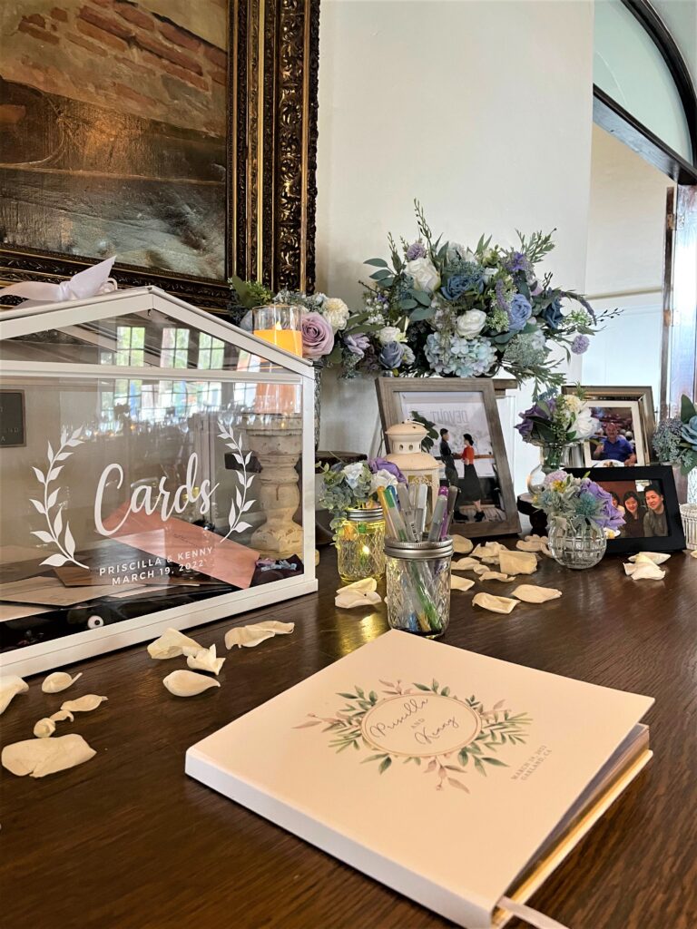 Wedding reception table with guestbook and decor.