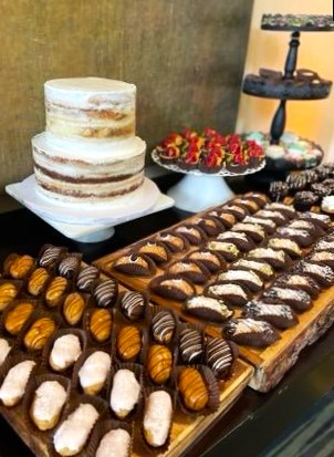 A table filled with lots of different types of desserts.