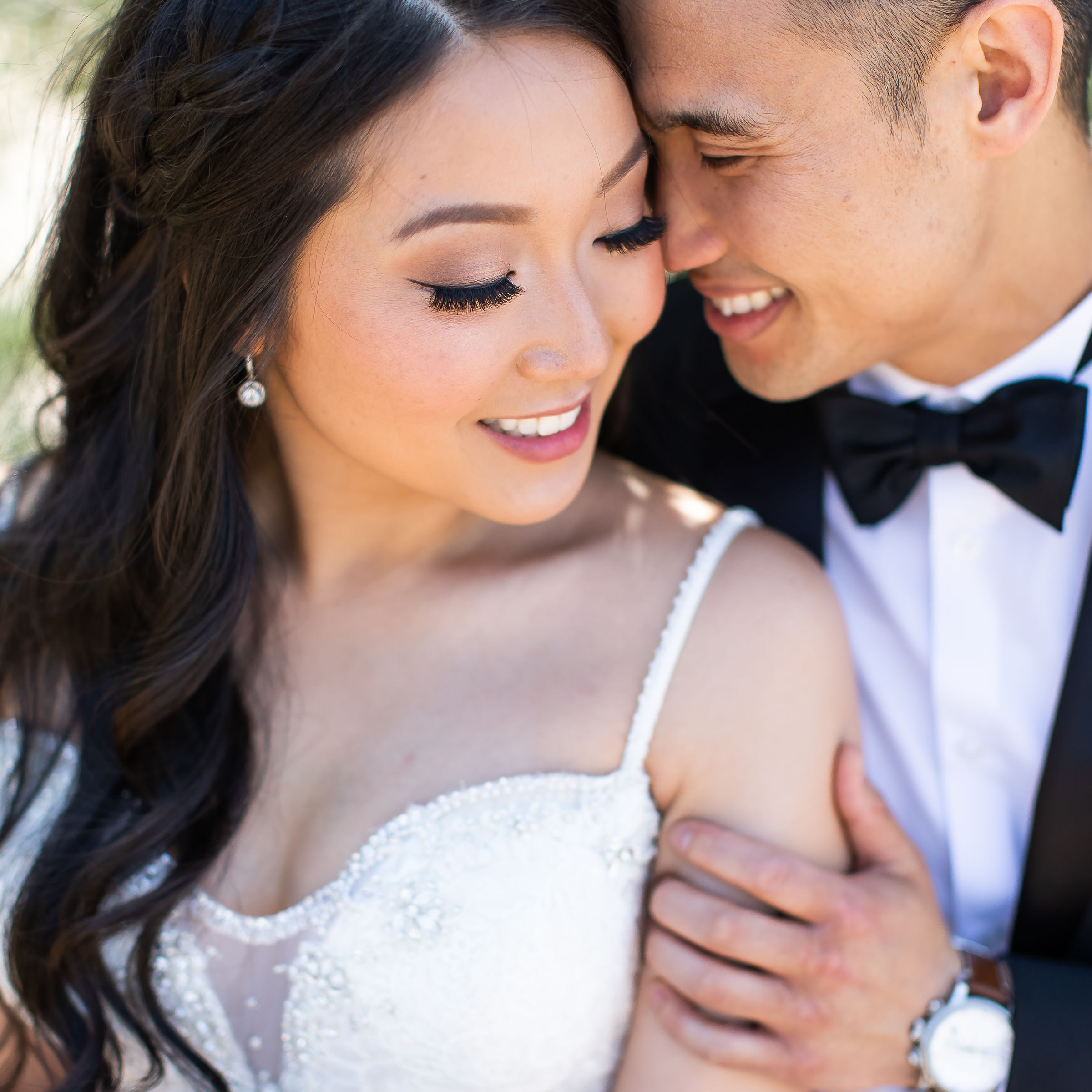 A man and woman are smiling for the camera.