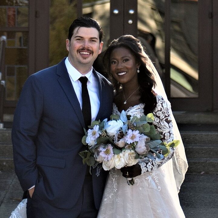 A man and woman posing for a picture.
