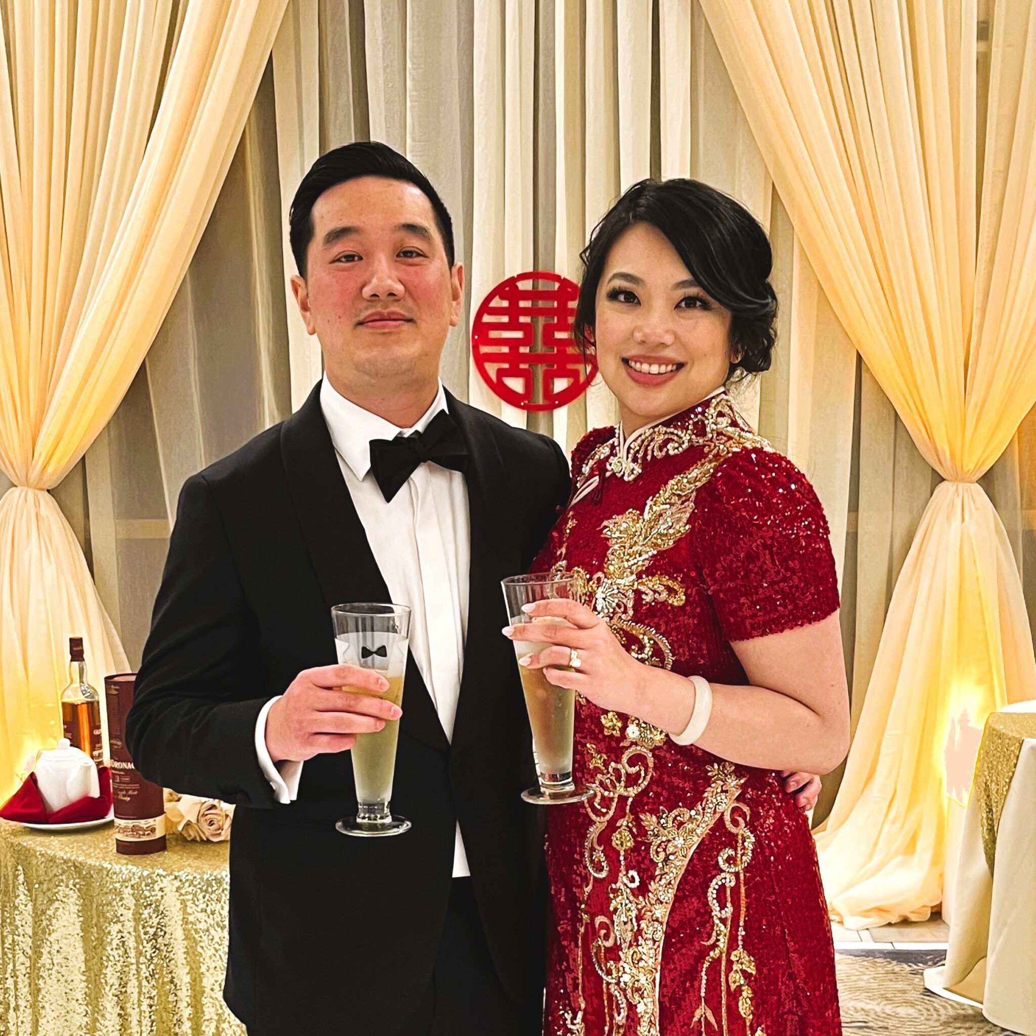 Outlook-bwfpky1e.2 A man and woman holding champagne glasses in front of a table.