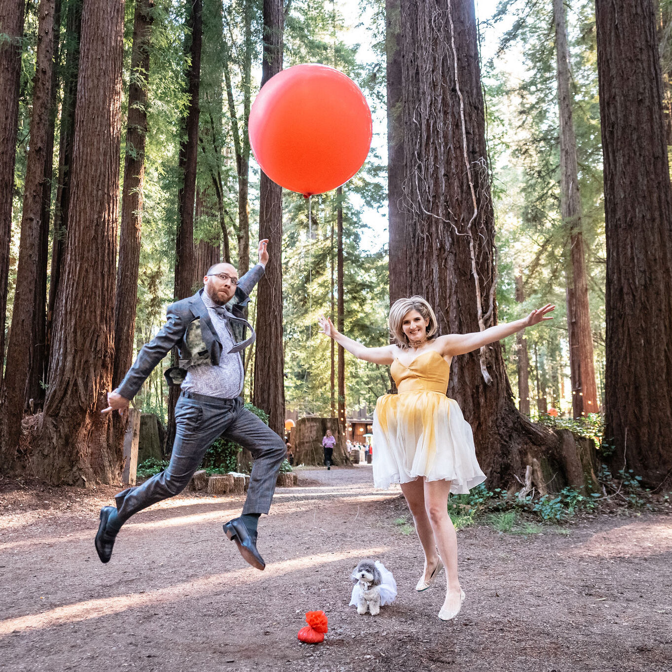 A man and woman playing with an orange ball.