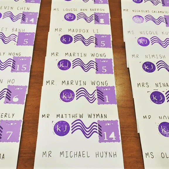 Screen Shot 2020-09-29 at 9.06.34 PM A table with many purple envelopes on it